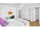 Comfortable bedroom featuring wood floors, a closet, and neutral décor, creating a serene and inviting space at 1961 E Stacey Rd, Gilbert, AZ 85298