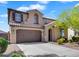 Charming two-story home features a neutral color palette, two-car garage, and well-maintained landscaping at 1961 E Stacey Rd, Gilbert, AZ 85298
