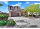 Charming two-story home featuring a two-car garage, landscaped front yard and a welcoming entrance at 1961 E Stacey Rd, Gilbert, AZ 85298