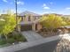 Charming two-story home showcasing a well-manicured front yard, two-car garage, and tile roof at 1961 E Stacey Rd, Gilbert, AZ 85298