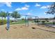 Community playground featuring swings, shade, picnic tables, and lake views for outdoor recreation at 1961 E Stacey Rd, Gilbert, AZ 85298