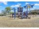 Community playground featuring play structures, slides, and shaded seating areas for families at 1961 E Stacey Rd, Gilbert, AZ 85298
