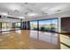 Spacious studio featuring hardwood floors, mirrors, and natural light for fitness and dance activities at 1961 E Stacey Rd, Gilbert, AZ 85298