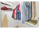 This walk-in closet with custom organizers provides easy access to clothing and accessories at 1961 E Stacey Rd, Gilbert, AZ 85298