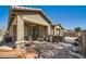 Spacious backyard patio with outdoor seating, bar area and lush landscaping at 2059 W Whisper Rock Trl, Phoenix, AZ 85085