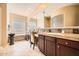 Spa-like bathroom with a double vanity, glass block window, and a separate tub at 2059 W Whisper Rock Trl, Phoenix, AZ 85085