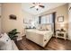 Charming bedroom with wood floors, a cozy upholstered bed and bedside tables at 2059 W Whisper Rock Trl, Phoenix, AZ 85085
