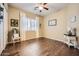 Inviting bedroom featuring hardwood floors, neutral walls and shuttered window at 2059 W Whisper Rock Trl, Phoenix, AZ 85085
