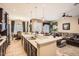 Open-concept kitchen featuring an island with pendant lighting, stainless steel appliances, and a breakfast bar at 2059 W Whisper Rock Trl, Phoenix, AZ 85085