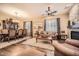Spacious living area with hardwood floors, fireplace, and access to the dining room at 2059 W Whisper Rock Trl, Phoenix, AZ 85085