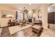 Comfortable living room featuring a stone fireplace, hardwood floors, and ample seating at 2059 W Whisper Rock Trl, Phoenix, AZ 85085