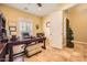 Inviting home office features a spacious desk, comfortable seating, and plenty of natural light at 2059 W Whisper Rock Trl, Phoenix, AZ 85085