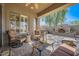 Comfortable covered patio with seating area and outdoor fireplace at 2059 W Whisper Rock Trl, Phoenix, AZ 85085