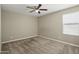 Bedroom with neutral walls, carpet, ceiling fan, and a window at 22302 E Camina Plata --, Queen Creek, AZ 85142