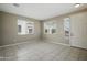 Versatile living room with neutral tones, tile flooring, and large windows at 22302 E Camina Plata --, Queen Creek, AZ 85142