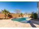 Backyard pool with mature trees and a brick surround at 22302 E Camina Plata --, Queen Creek, AZ 85142