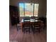 Dining area bathed in natural light with backyard views at 23497 S 212Th St, Queen Creek, AZ 85142