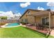 Spacious backyard with a refreshing pool and covered patio, ideal for outdoor entertaining and relaxation at 2644 E Sylvia St, Phoenix, AZ 85032