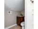 Cozy bathroom featuring a dark wood vanity with granite countertops and updated fixtures, perfect for a guest bath at 2644 E Sylvia St, Phoenix, AZ 85032
