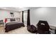 Inviting bedroom with a dark bed and themed decor, featuring a dark beanbag chair and gaming chair at 2644 E Sylvia St, Phoenix, AZ 85032