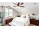 Charming bedroom featuring natural light, a sloped ceiling and a comfortable bed at 2644 E Sylvia St, Phoenix, AZ 85032