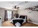 Relaxing bedroom with a comfortable bed, stylish decor, and natural light from the window at 2644 E Sylvia St, Phoenix, AZ 85032
