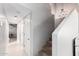 Long hallway leading to the upper level with carpeted stairs at 2644 E Sylvia St, Phoenix, AZ 85032