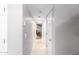 Bright hallway with tile flooring leading to bedrooms and closets at 2644 E Sylvia St, Phoenix, AZ 85032