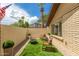 Private patio with a fire pit, seating, turf, and gravel at 2644 E Sylvia St, Phoenix, AZ 85032