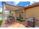 Inviting covered patio with a grill, perfect for outdoor dining and entertaining near the refreshing pool at 2644 E Sylvia St, Phoenix, AZ 85032