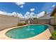 Well-maintained backyard pool with desert landscaping, offering a refreshing escape and a private outdoor retreat at 2644 E Sylvia St, Phoenix, AZ 85032