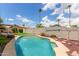 Beautiful backyard pool with desert landscaping, ideal for cooling off and enjoying the serene outdoor setting at 2644 E Sylvia St, Phoenix, AZ 85032