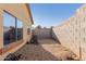 Backyard featuring low-maintenance landscaping with gravel, and high block wall for privacy at 2656 E Longhorn Pl, Chandler, AZ 85286