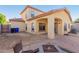 A spacious backyard with a covered patio, hardscape, and fire pit, perfect for outdoor living and entertaining at 2656 E Longhorn Pl, Chandler, AZ 85286