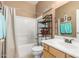 Bathroom featuring a shower with a bathtub, a sink, and a decorated beach theme at 2656 E Longhorn Pl, Chandler, AZ 85286