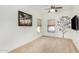 Bright bedroom featuring neutral carpet, a ceiling fan, and wall decor at 2656 E Longhorn Pl, Chandler, AZ 85286