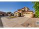 Two-story corner-lot home with low maintenance desert landscaping, a two-car garage and clay tile roof at 2656 E Longhorn Pl, Chandler, AZ 85286