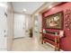 Inviting foyer with tile flooring, neutral walls, and an alcove with a wood table and decorative accents at 2656 E Longhorn Pl, Chandler, AZ 85286