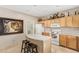 Well-lit kitchen showcasing a cooking space with a large island and white appliances at 2656 E Longhorn Pl, Chandler, AZ 85286