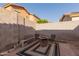 A cozy patio features a fire pit, chairs, and a stylish outdoor rug, perfect for relaxing and entertaining at 2656 E Longhorn Pl, Chandler, AZ 85286