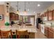 Open kitchen featuring granite countertops, ample cabinetry, and modern appliances at 26735 N 127Th Dr, Peoria, AZ 85383