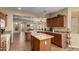 Well-appointed kitchen with granite countertops, an island, and stainless steel appliances at 26735 N 127Th Dr, Peoria, AZ 85383