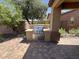 This outdoor kitchen features a built-in grill with stainless steel accents and a countertop for food preparation at 26735 N 127Th Dr, Peoria, AZ 85383