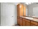 Bathroom featuring a cabinet tower on the countertop and next to the door with hardware in silver color at 29606 N Tatum Blvd # 128, Cave Creek, AZ 85331