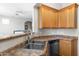 Kitchen view highlighting the stainless steel sink, appliances, and counter space at 29606 N Tatum Blvd # 128, Cave Creek, AZ 85331