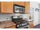 Close-up of a well-equipped kitchen with stainless steel oven and gas range at 29606 N Tatum Blvd # 128, Cave Creek, AZ 85331