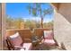 Relaxing patio with desert views, seating, and a small accent table at 29606 N Tatum Blvd # 128, Cave Creek, AZ 85331