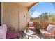 Inviting covered patio space with comfortable seating and scenic desert views at 29606 N Tatum Blvd # 128, Cave Creek, AZ 85331