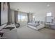 Serene bedroom with large window, comfortable bed, and stylish furnishings at 3015 W Irvine Rd, Phoenix, AZ 85086