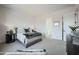 Spacious bedroom featuring luxurious bedding, modern décor, and a calming ambiance at 3015 W Irvine Rd, Phoenix, AZ 85086